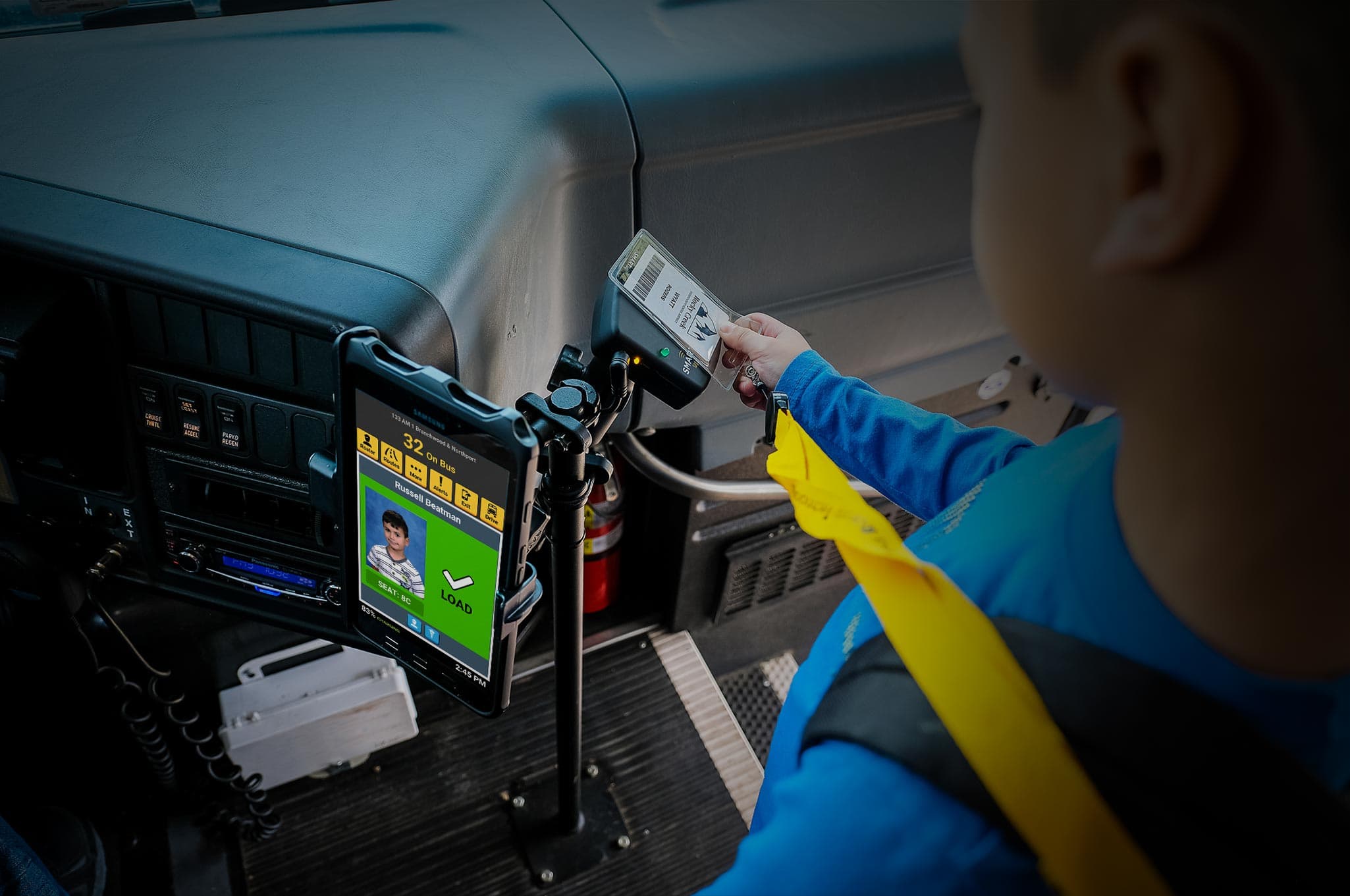 A picture of a student tagging off a bus with an NFC card.